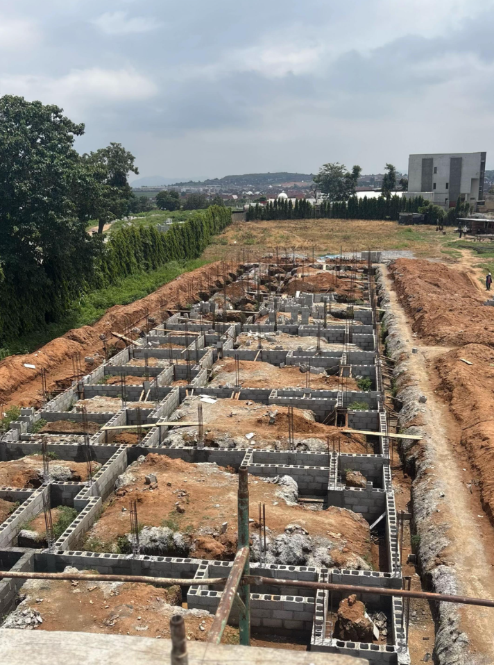Aerial view of a large blockwork foundation and rebar on a construction site